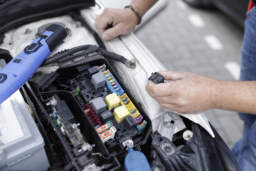 Man pulling fuses to find and diagnose PCM issues, when should be using scan tool.