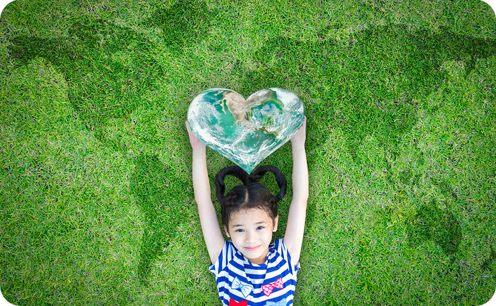 Girl on grass with heart