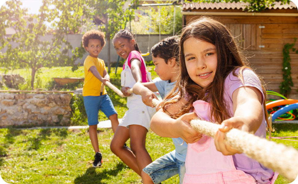 kids playing tug of war summer camp