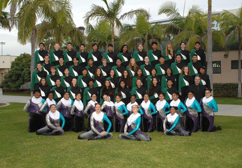 band members with colorguard standing and smiling