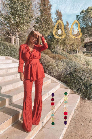 María Pombo in a red satin dress with Portobello earrings and Giselle pearl earrings.