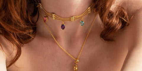 Golden choker necklace with colored stones inspired by the Tarot.