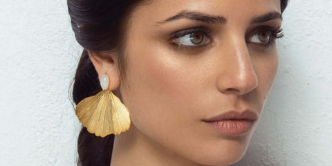 Golden earrings for wedding and perfect guest in the shape of a leaf.
