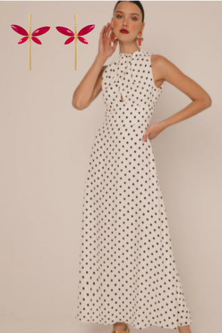 Spring wedding guest midi dress with polka dots and long butterfly earrings