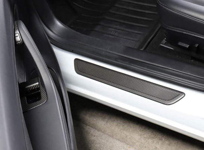 https://cdn.shopify.com/s/files/1/0266/2688/3639/products/pimpmyev-scuff-plates-4pcs-genuine-carbon-fiber-style-scuff-plates-door-sill-covers-for-model-y-matte-2020-2021-15216367861815_420x.jpg?v=1628238098