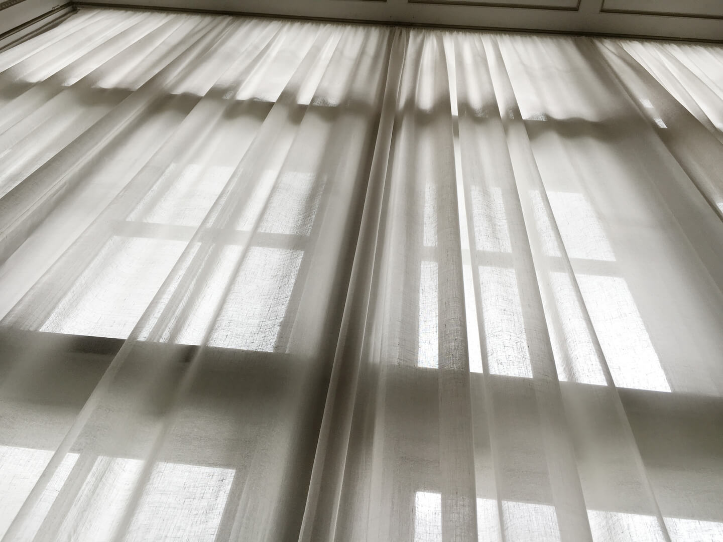 Upward view of a linen curtain