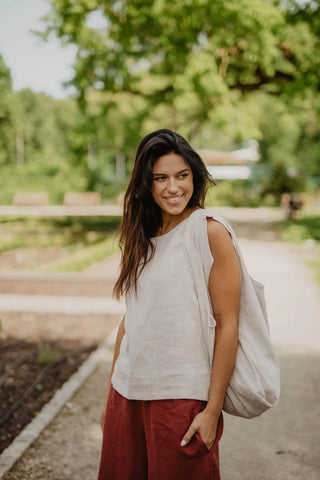 Woman Wearing A White Color Linen Tank Top