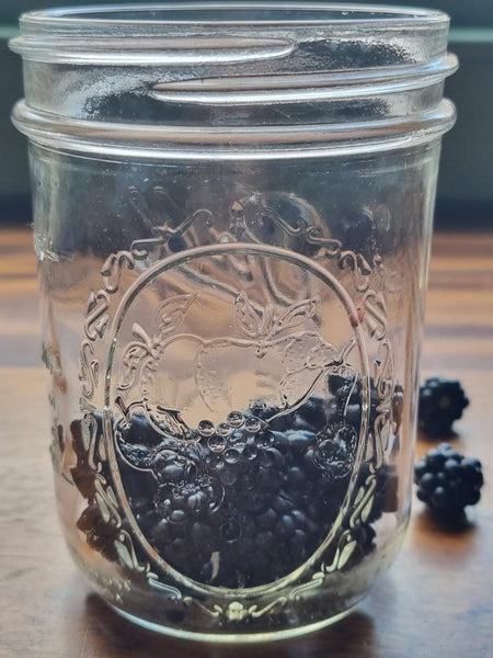 Blackberries in Ball mason jars