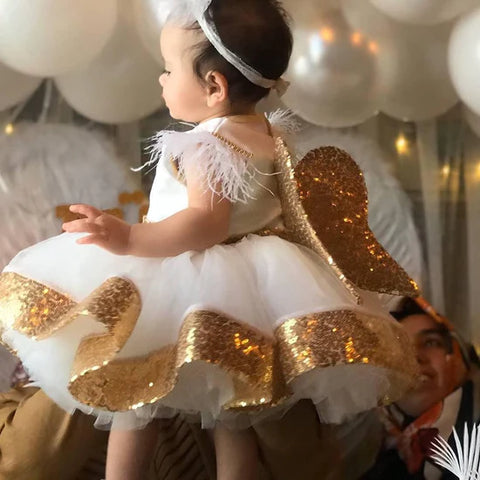 gold glittery sequin bow dress for first birthday