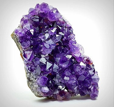 a purple crystal rock with crystals amethyst