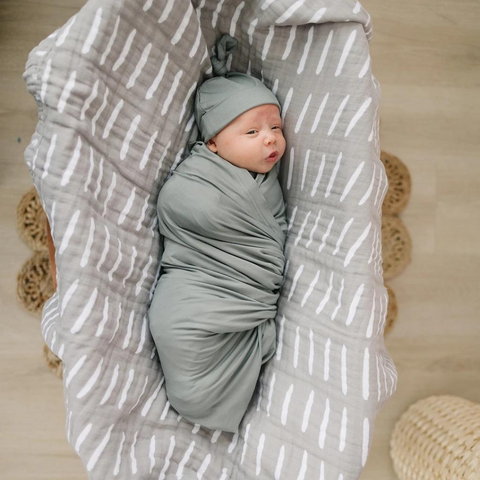 baby in swaddle blanket