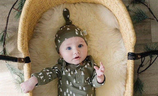 An image of a baby wearing a Mebie Baby Knot Hat