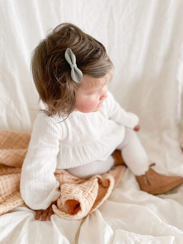 Baby Luca wearing the Coconut Romper by Luca Elle