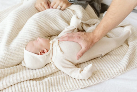  A baby wearing organic baby sleepwear by Goumi