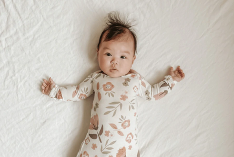 A baby wearing organic baby sleepwear by Gunamuna