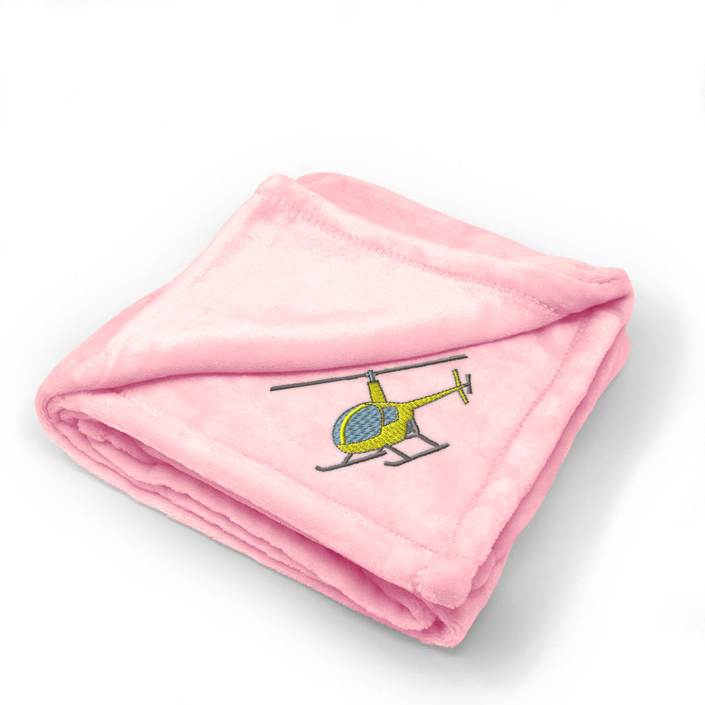 pink blanket with a helicopter on it