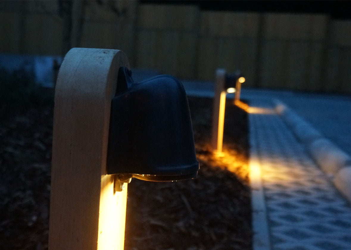 Authentage_balume on wooden pole_night_warm light outdoor garden light