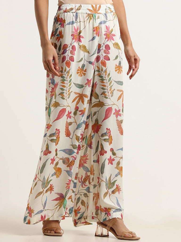 Buy White Black Vogue Print Palazzo Pants at Social Butterfly Collection  for only $ 89.00