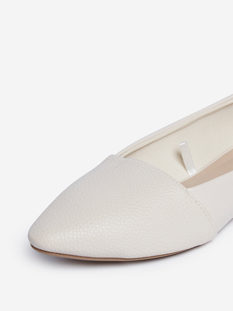 white pointed flats