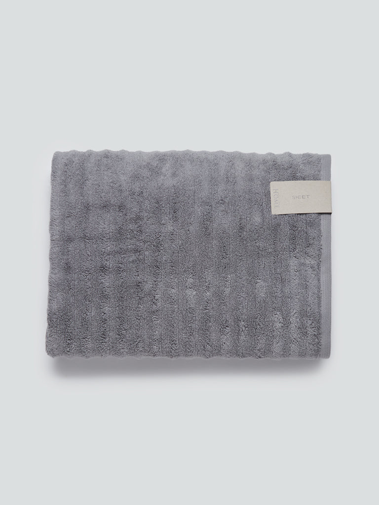 grey bath mats and towels