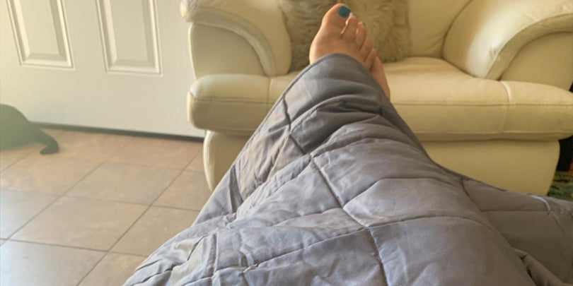 First Person View Of Customer Lying Under Weighted Blanket