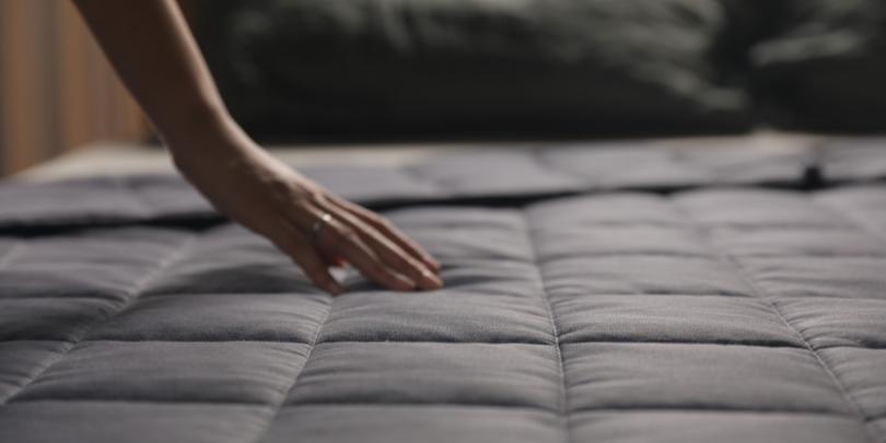 Hand Resting on Charcoal YNM Weighted Blanket