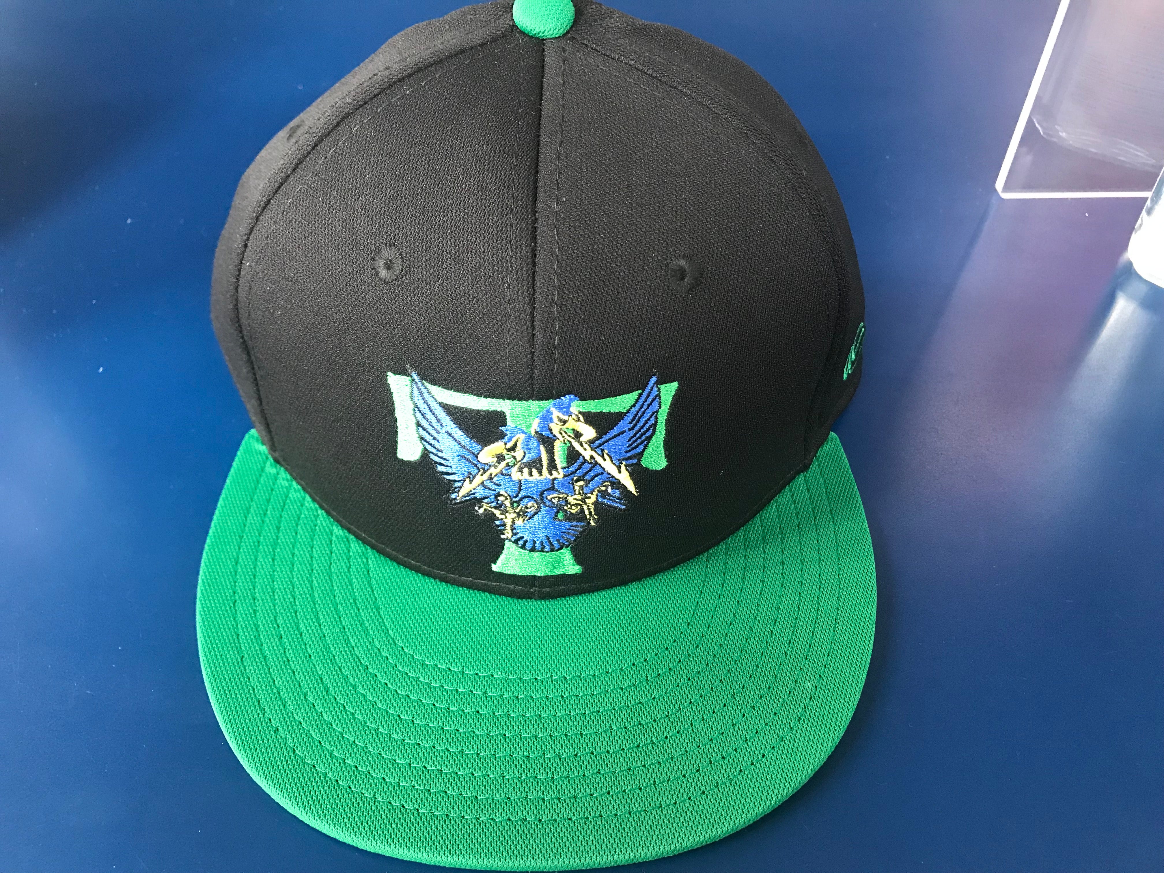 green and black fitted hat