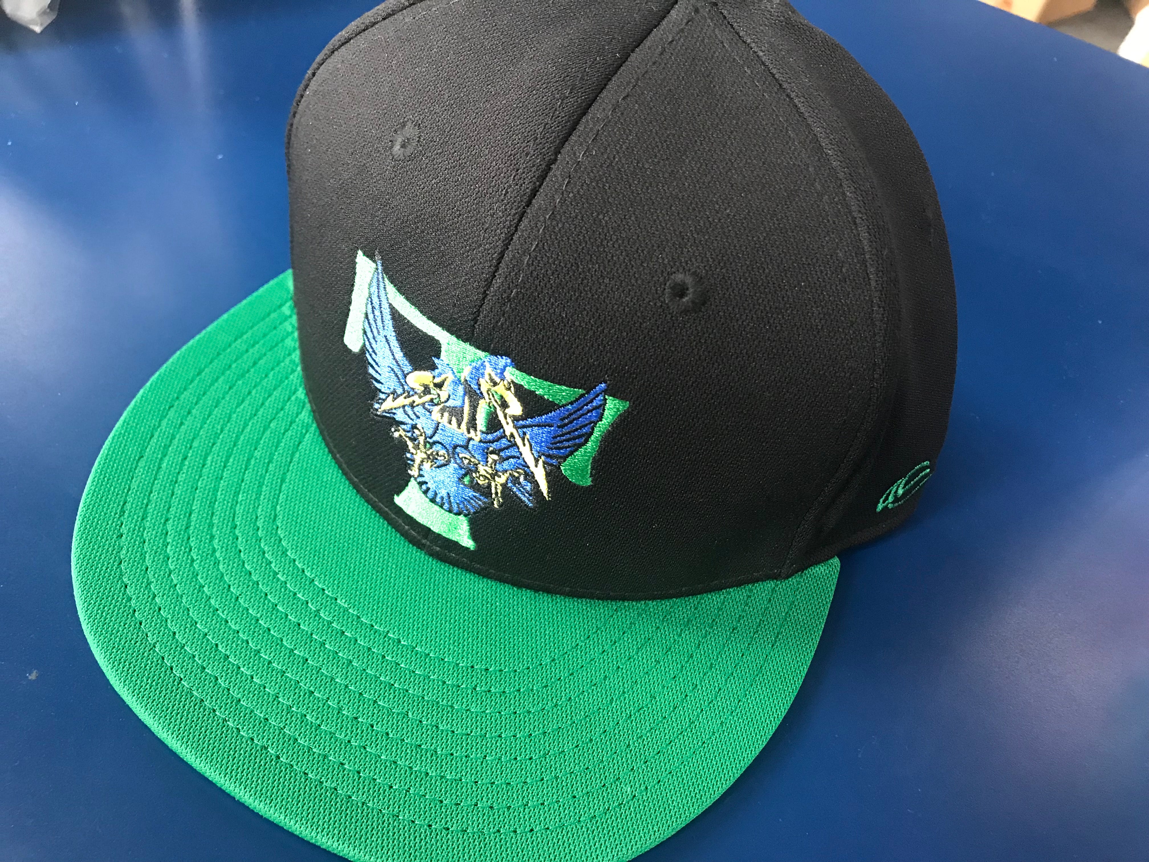 green and black fitted hat