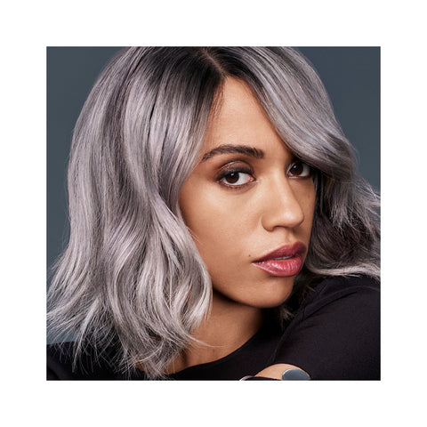 A woman with grey hair and a black shirt - Josh Wood Hair Colour Expert