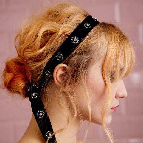 A woman with red hair wearing a black velvet headband - Josh Wood Hair Colour Expert