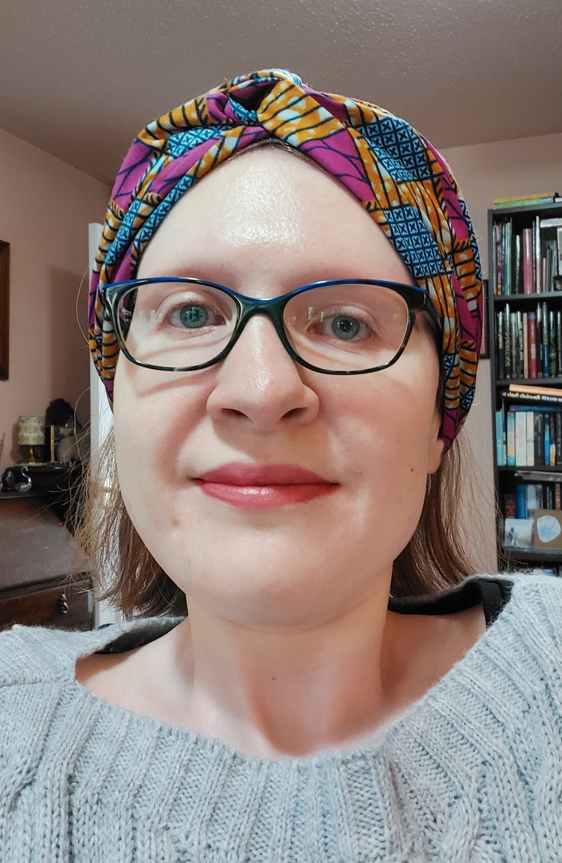 A woman wearing glasses and a turban - Josh Wood Hair Colour Expert