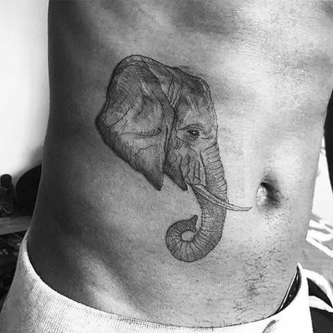 tatouage éléphant sur le ventre