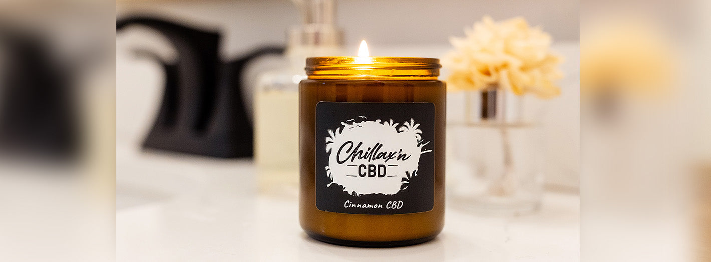 cbd candle burning in bathroom 