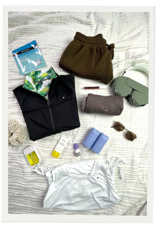 Image features essential Love Fitness items to pack on your next vacation.