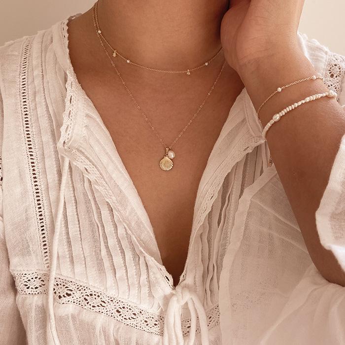 Dainty Pearl Necklace with Seashell Charm layered with Guiding Light Pearl Necklace