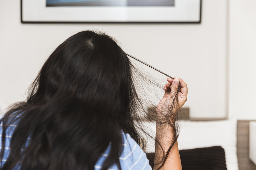 woman tugging hair