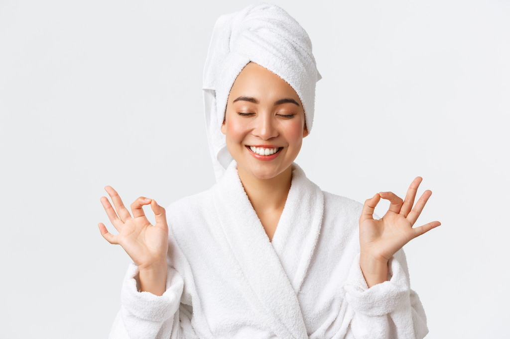 woman in bathrobe and hair wrapped in towel