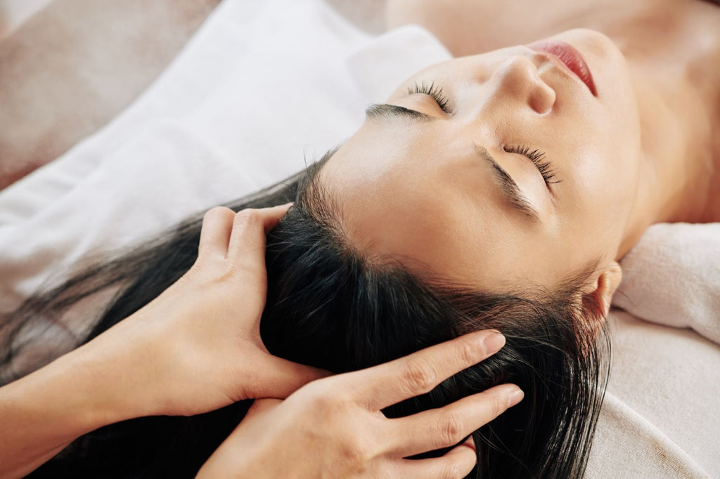 woman receiving scalp massage