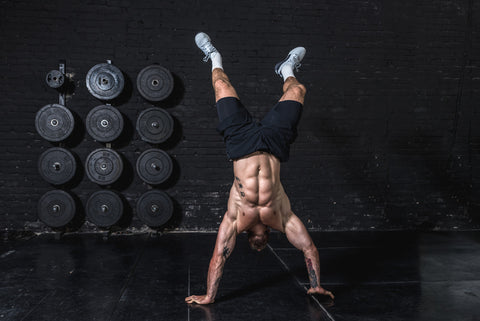 Man performs a handstand walk