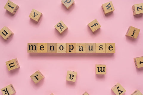 menopause spelled out in wooden word block