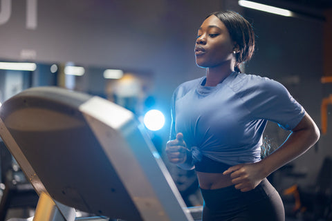 woman running on the treadmill in the gym