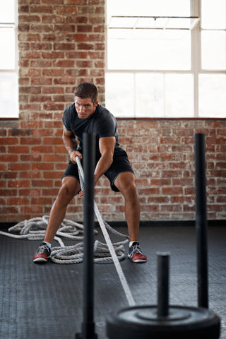 Man performs a sled pull