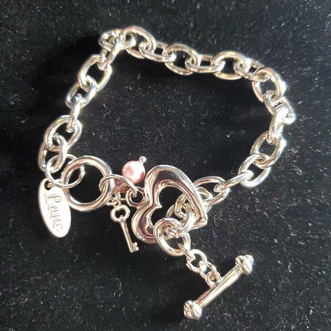 Under the Cherry Blossoms artist Gail Bonsignore's silver chain heart bracelet