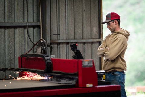 Michael watching the plasma table cut out post caps