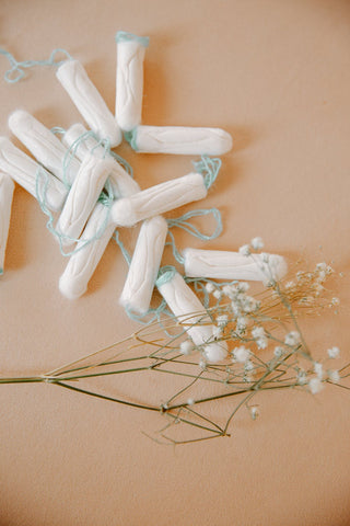 tampons and flowers on the table