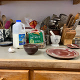 cooking with a pottery plate and pottery bowl 