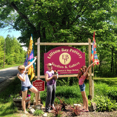 Ellisonn Bay Pottery Sign and people