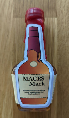 Makers Mark bottle with MACRS Mark accounting sticker