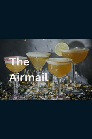 The airmail cocktails with lime garnishes and confetti strewn about