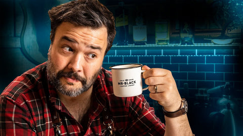 YouTube thumbnail of Greg Titian holding a Mr Black Coffee Mug for the How To Drink Episode Irish Coffee, History, & Twists